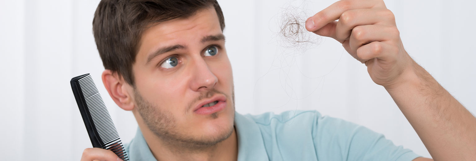Man having a hair losing problem
